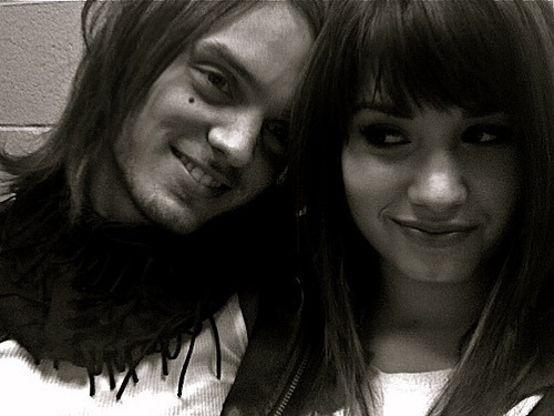Demi Lovato and Alex Deleon from The Cab posted a joint message on Buzznet